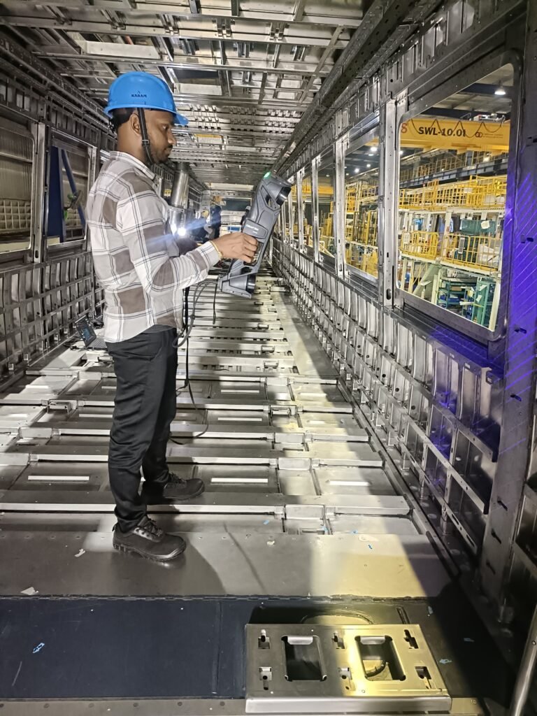 Close-up of Creaform HandySCAN 3D MAX portable optical CMM scanning complex mounting geometry