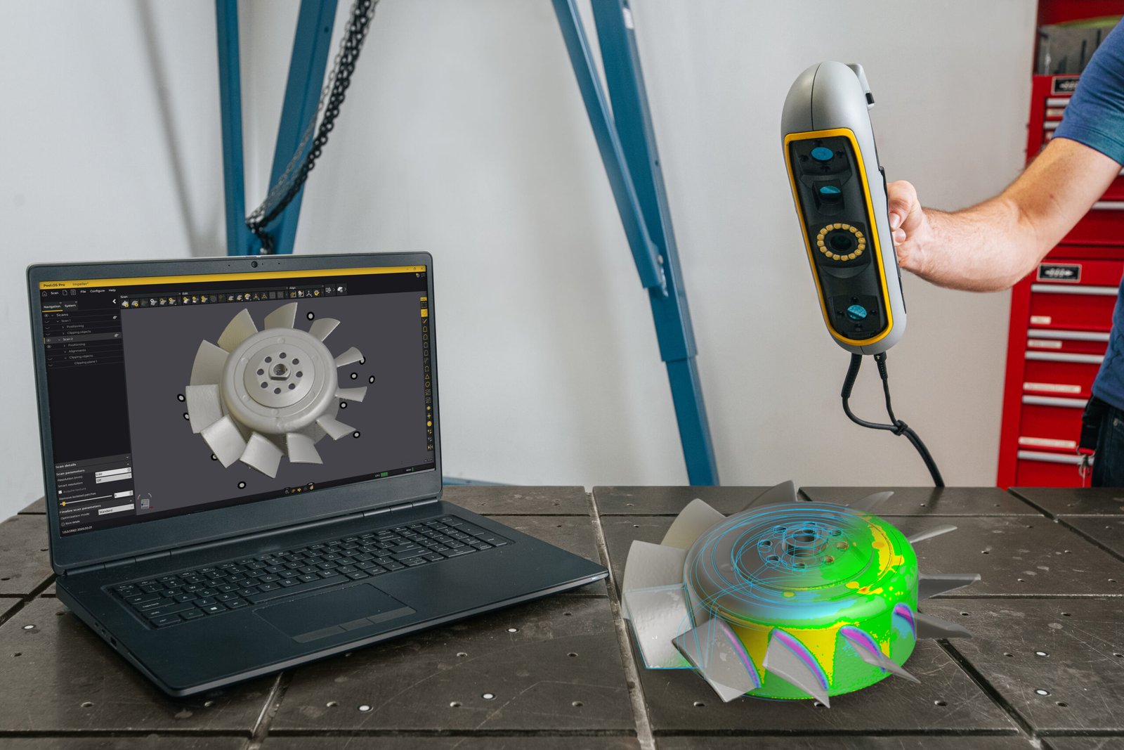 Peel 3 handheld scanner beside an impeller and laptop displaying its digital model